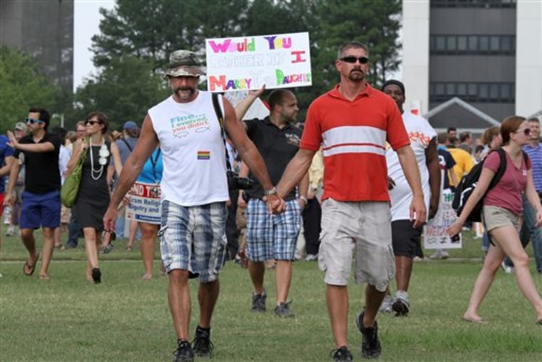 Steve Tanis, left, and his partner Rich Garraputa, both from Greensboro, N.C., walk toward the Noth Carolina Legislative Building after a rally against a state constitutional amendment that would say marriage between a man and a woman is the only domestic legal union in North Carolina, on Halifax Mall in Raleigh, N.C., Tuesday, Sept. 13, 2011. The N.C. Senate voted Tuesday to put the marriage issue to a vote in 2012. The men have been together for 13 years. 